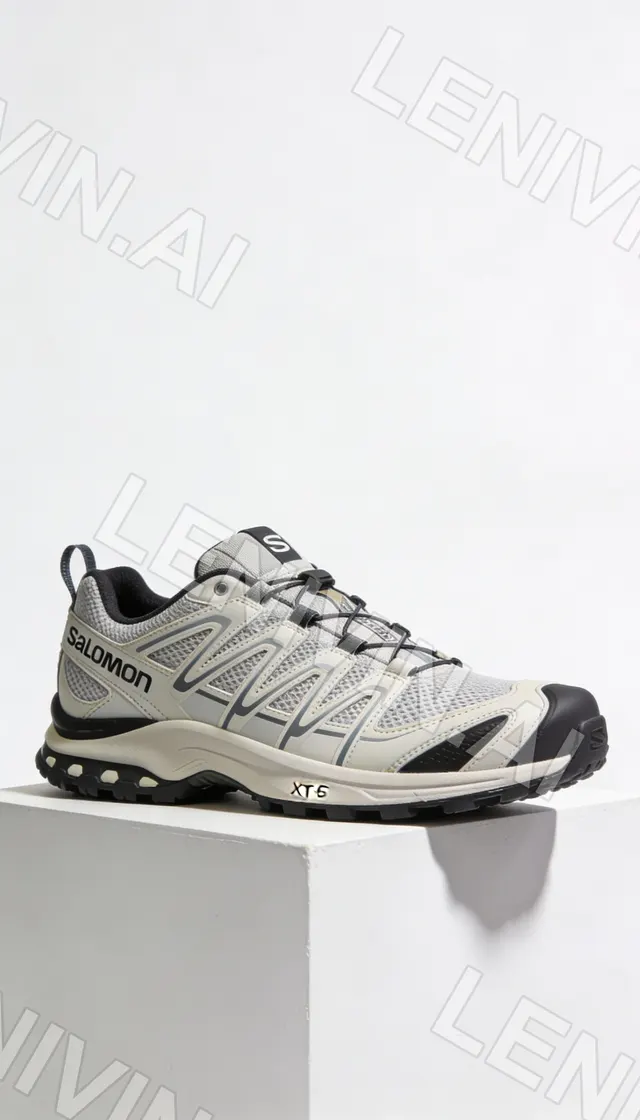 Серо-бежевые кроссовки Salomon XT-6 на белом кубе, вид сбоку